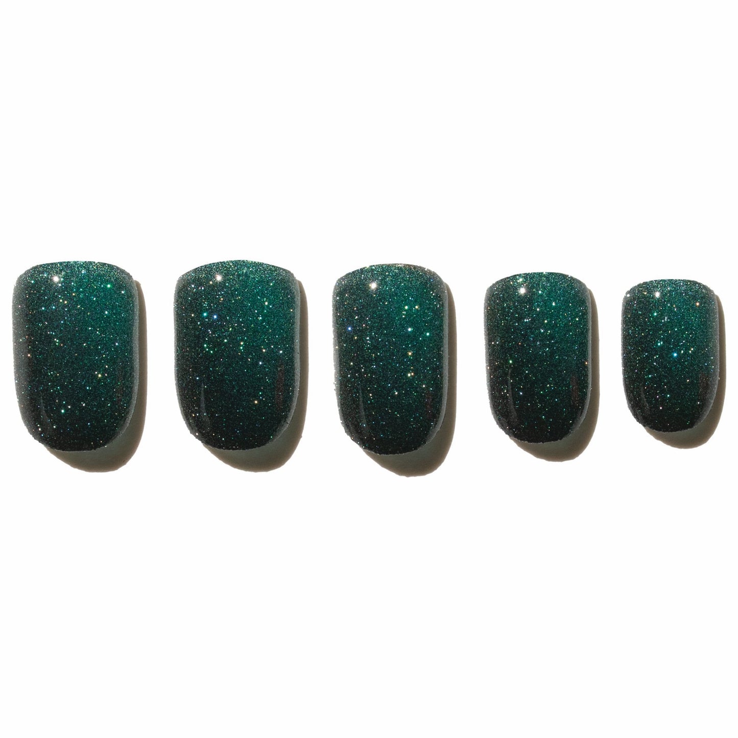 Five green glittery press on nails on a white background