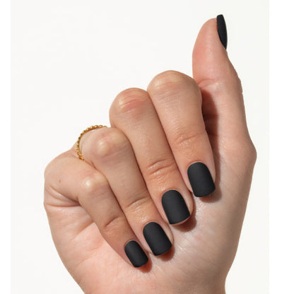 Hand with black press on nails on a white background
