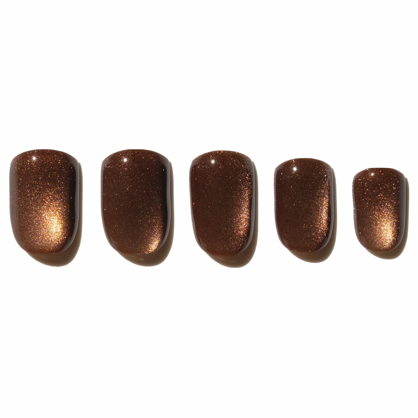 Five brown press on nails on a white background