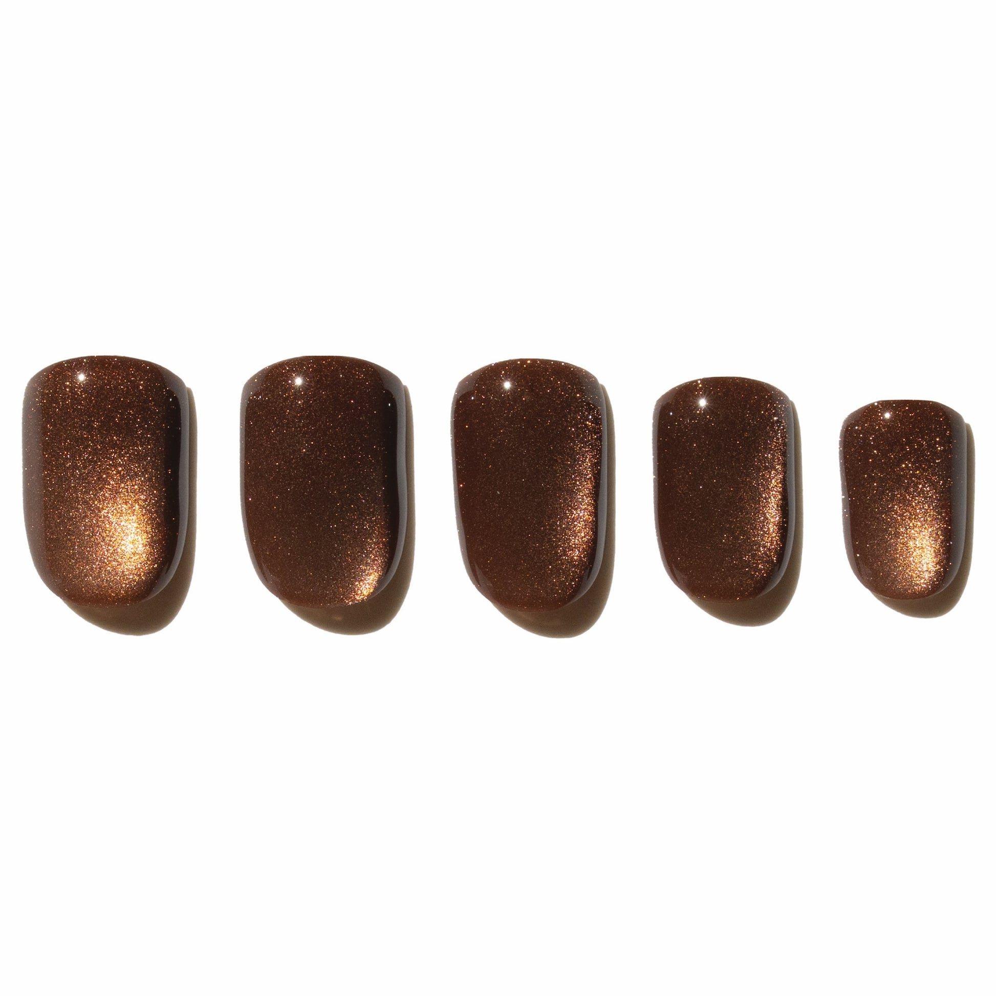 Five brown press on nails on a white background