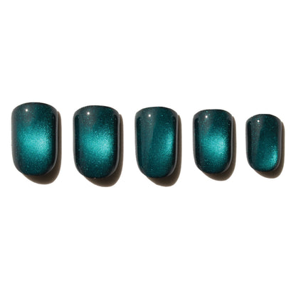 Five teal cats eye nail press on nails arranged in a row on a white background