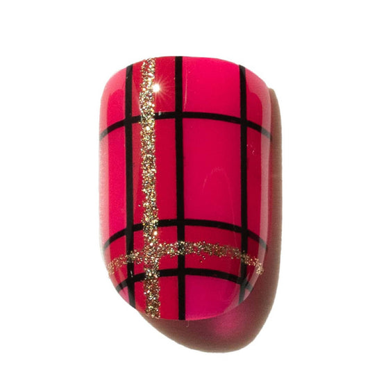 Press on Nail with pink plaid design and black and gold accents on a white background