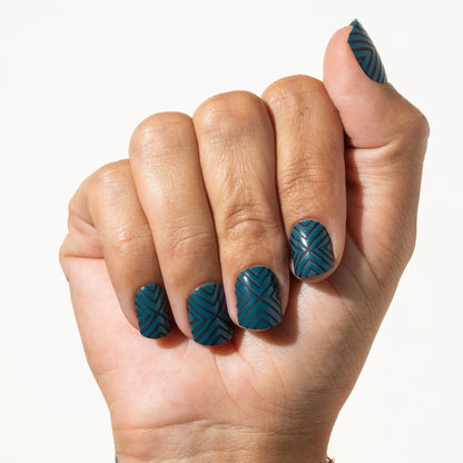 Hand with geometric press on nails on a white background