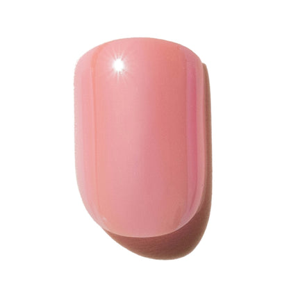 Single pink press on nail on a white background
