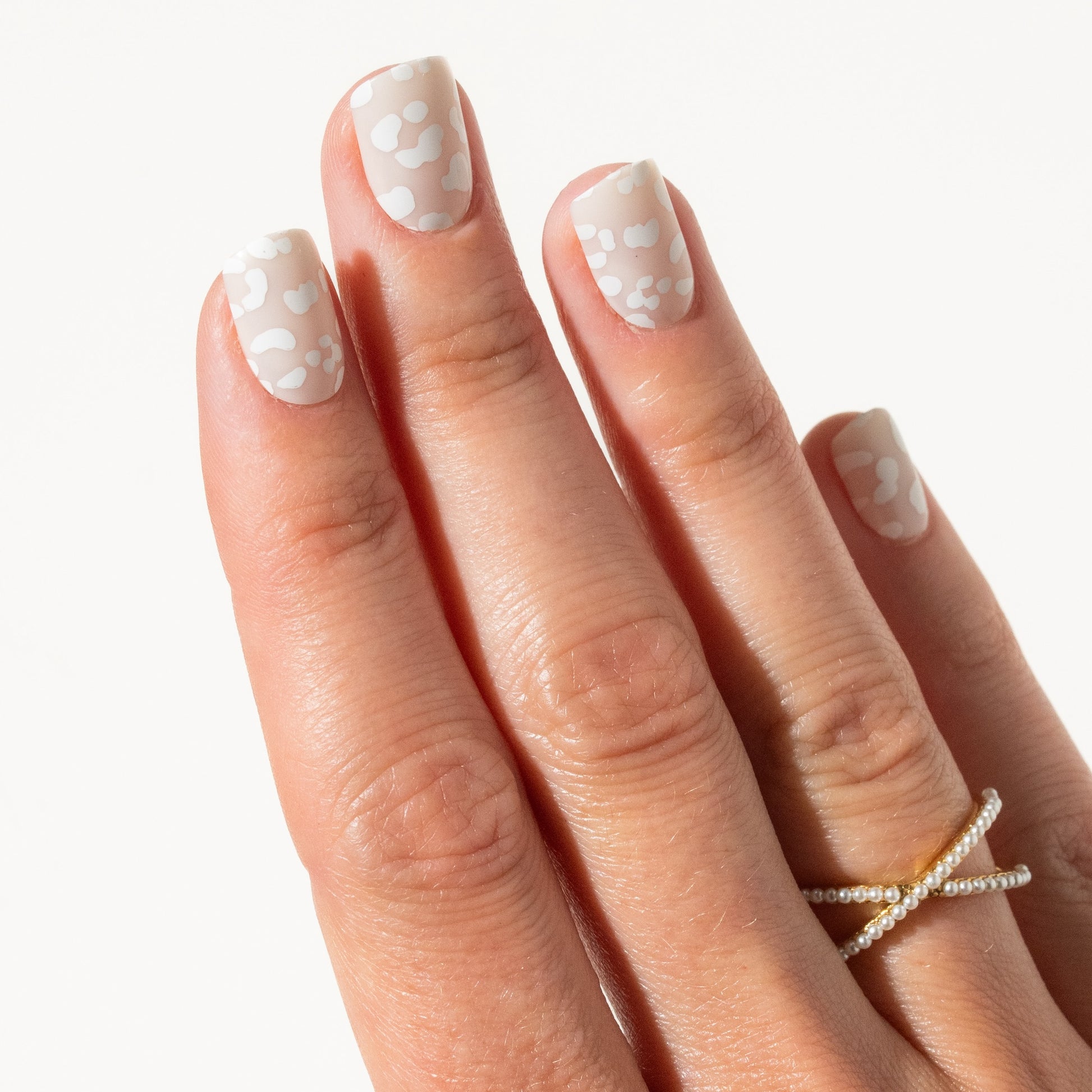 Hand with leopard press on nails