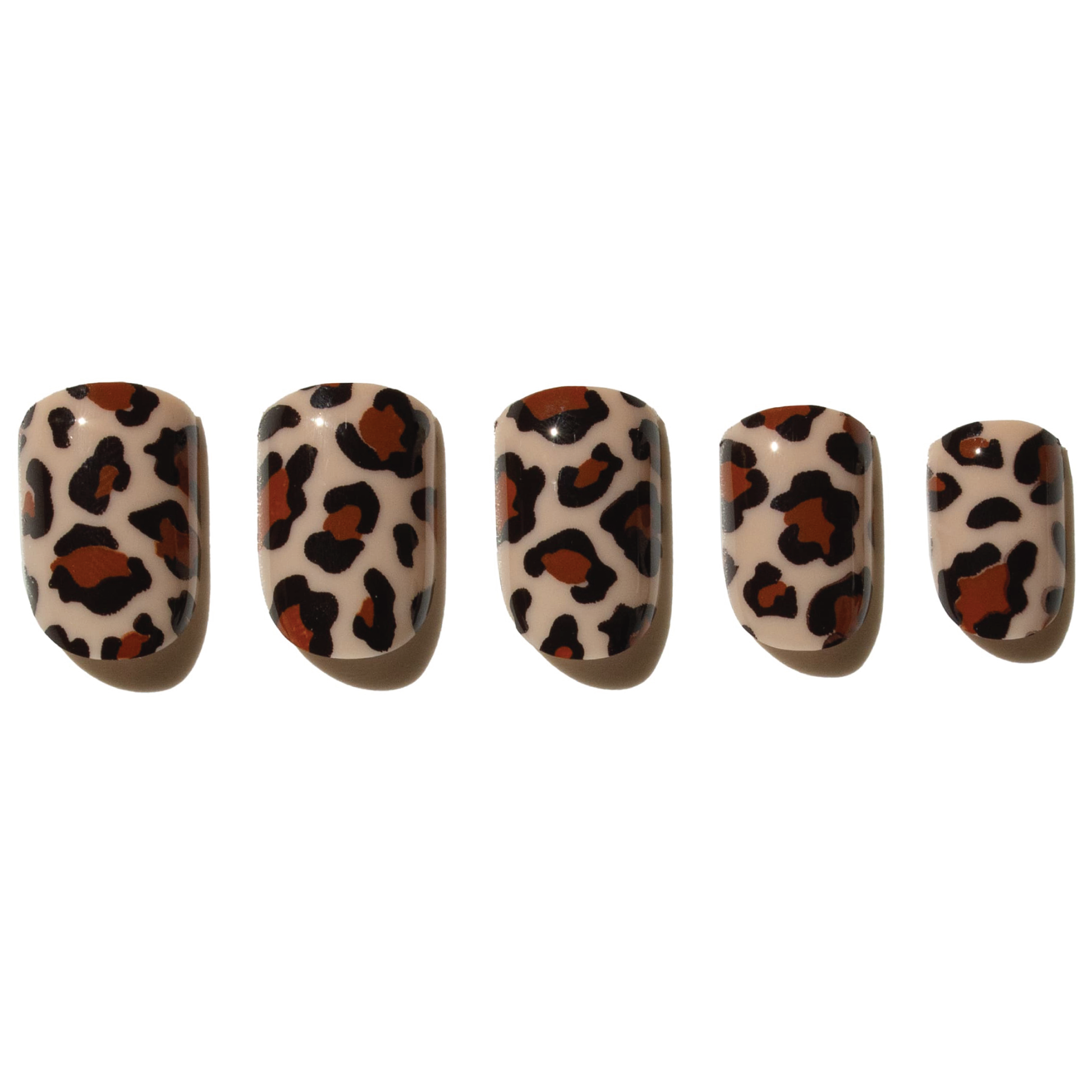Five press on nails with leopard print design on a white background