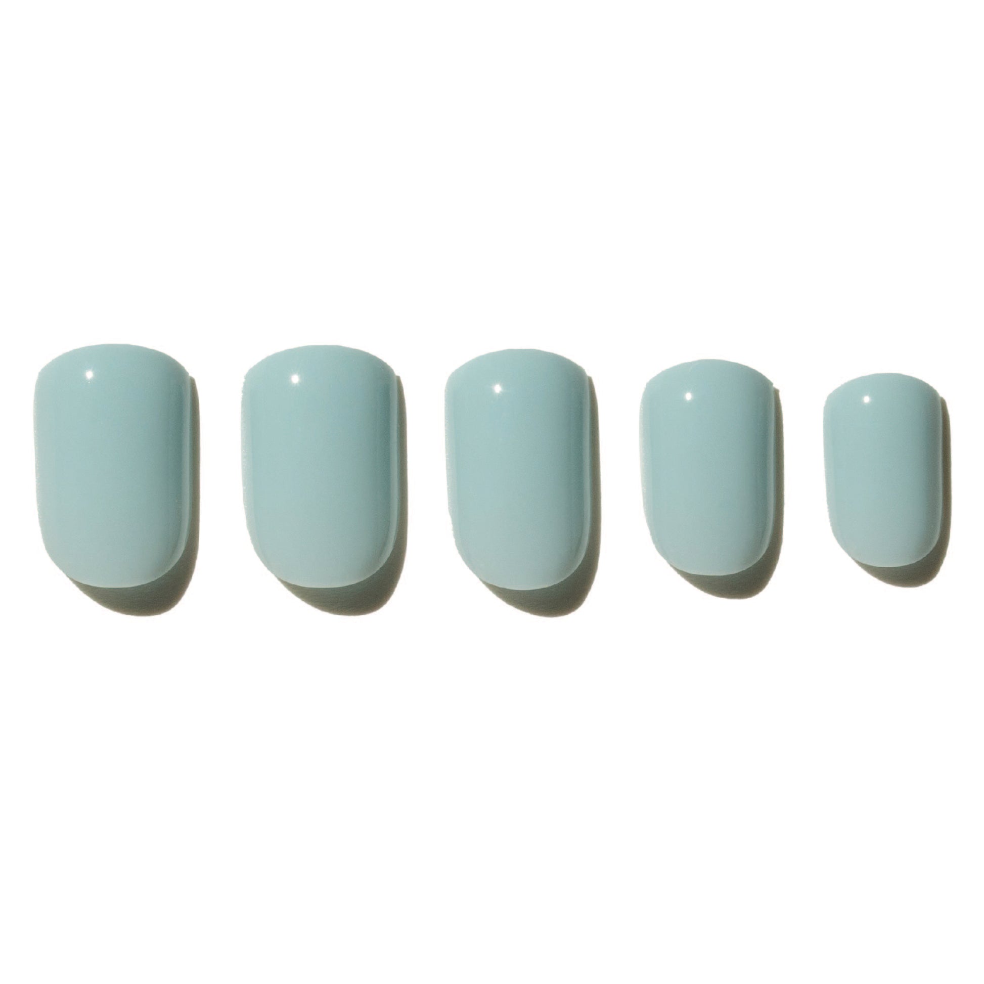 Five light blue press on nails on a white background