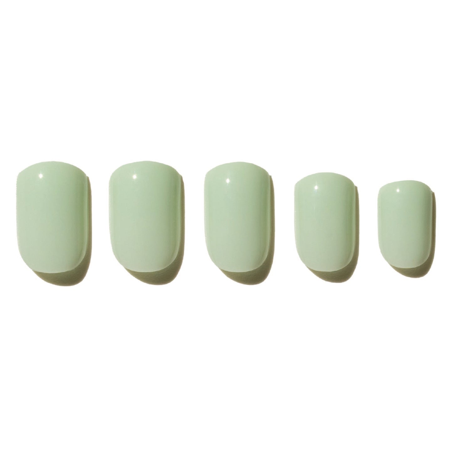 Five light green press on nails on a white background