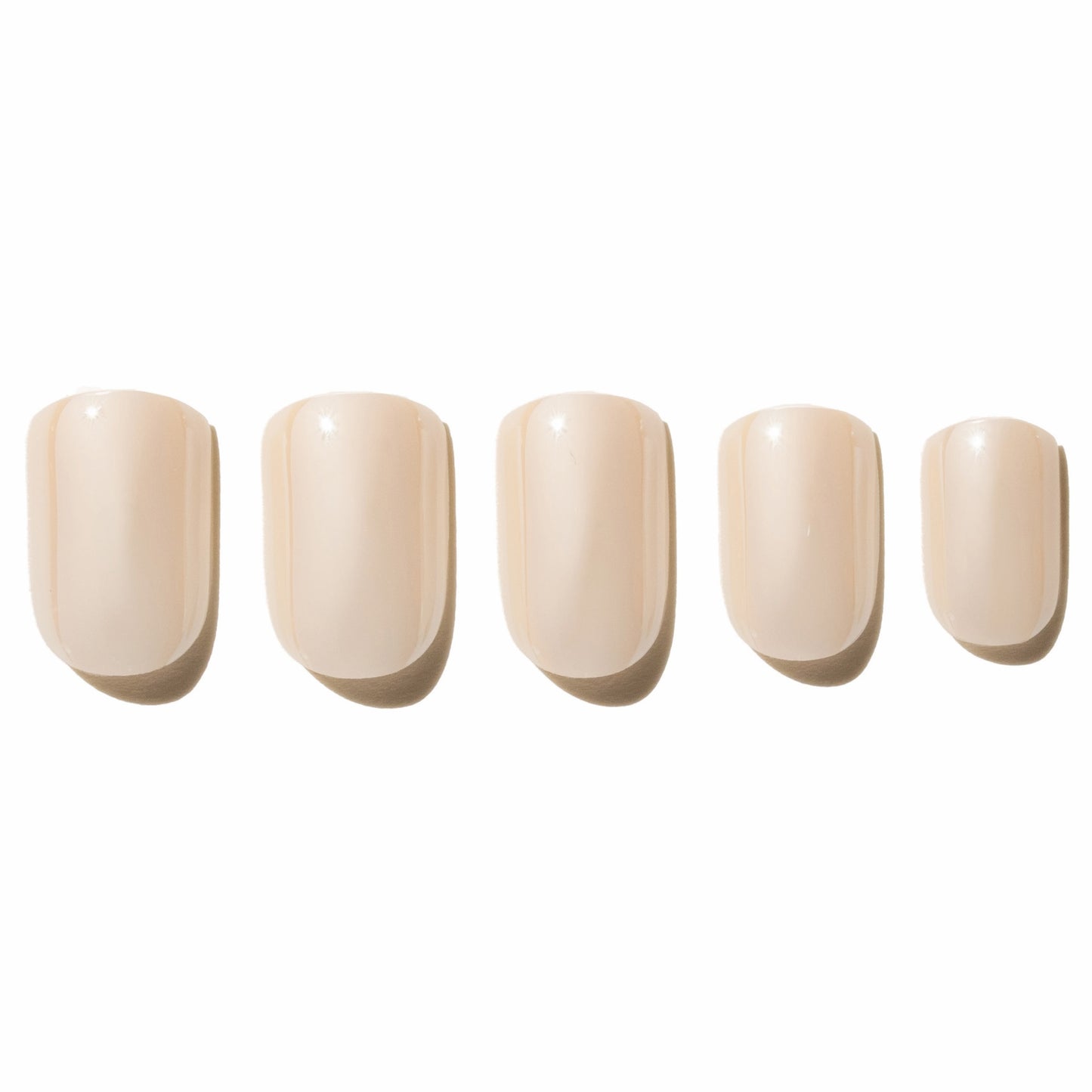 Five off white press on nails on a white background