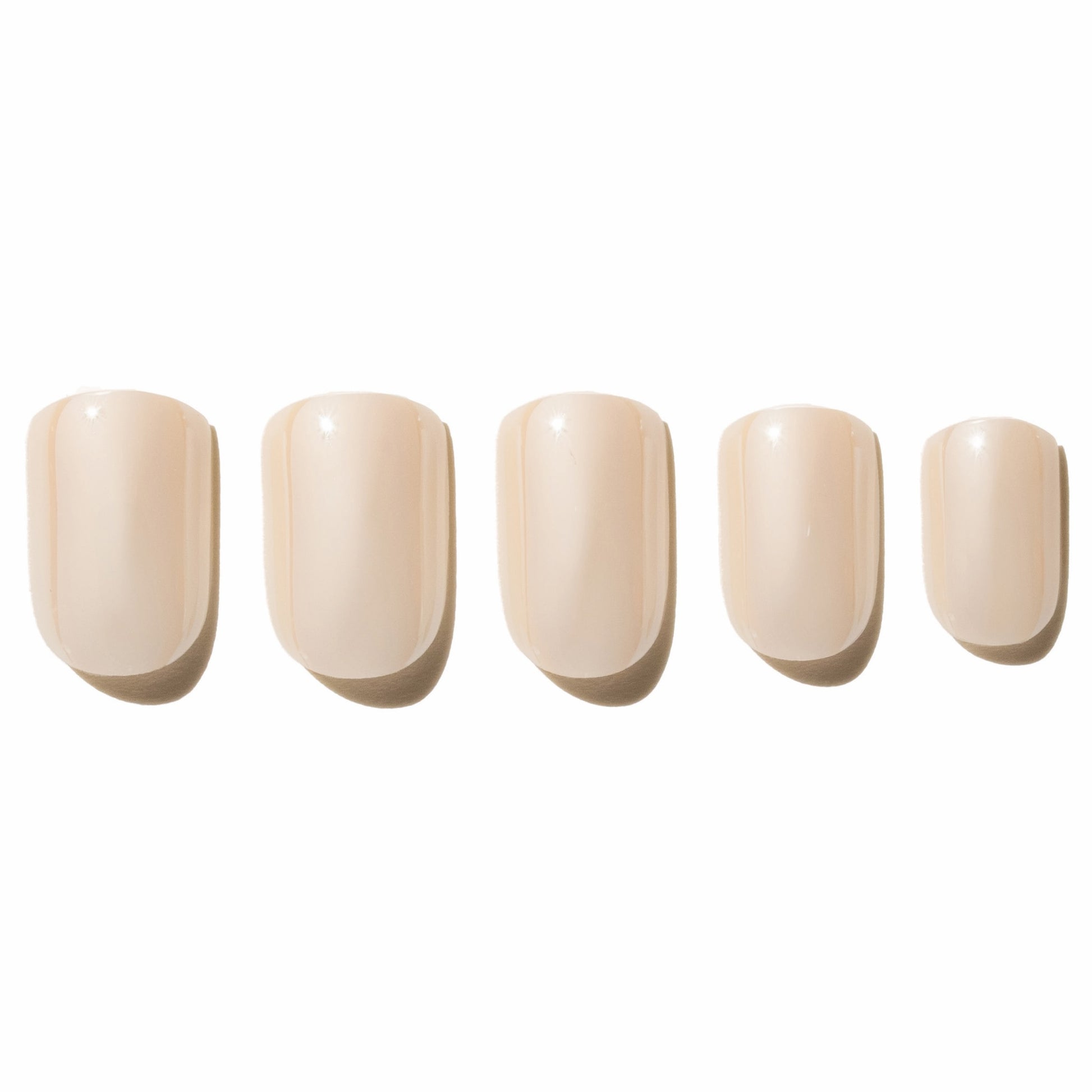 Five off white press on nails on a white background