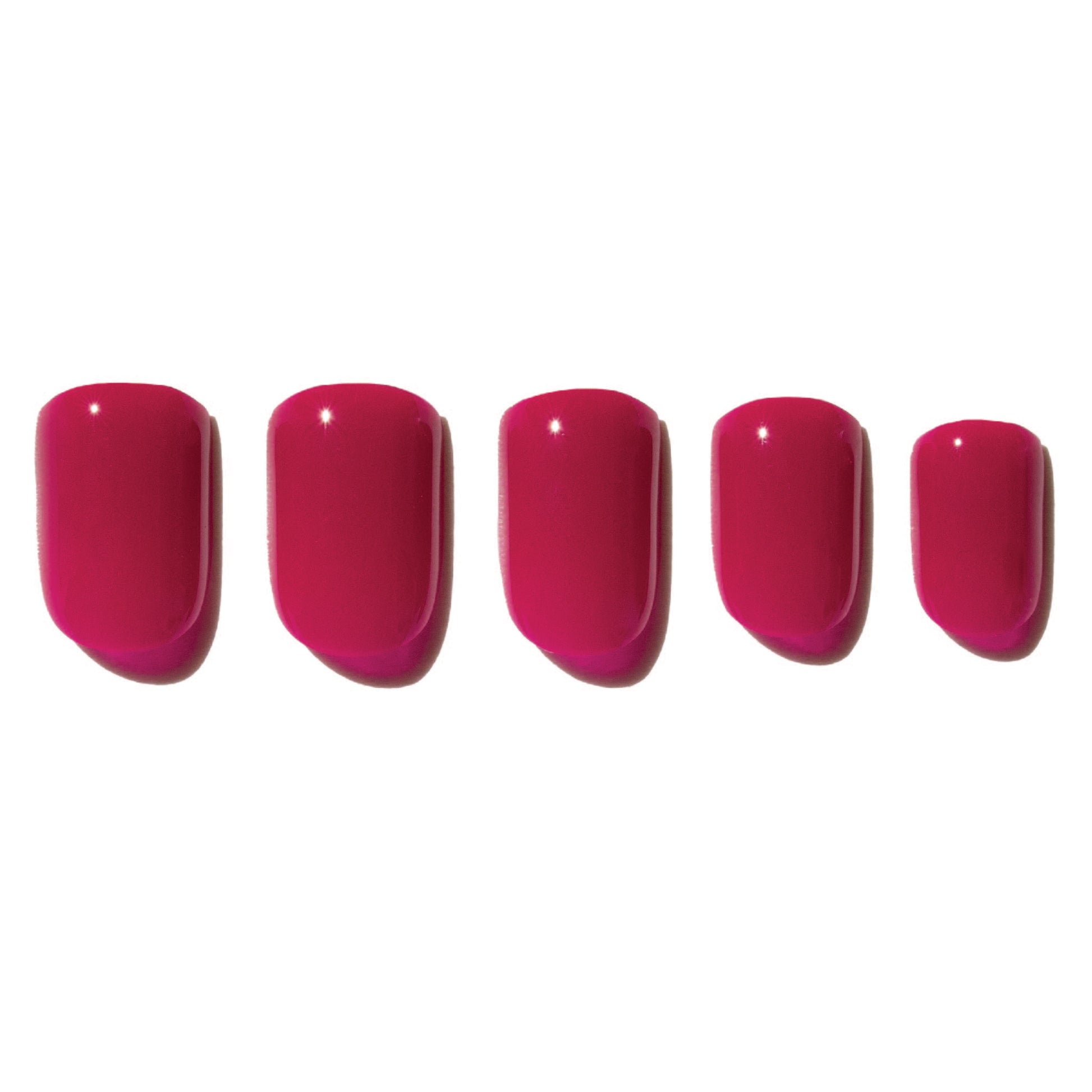 Five pink press on nails on a white background