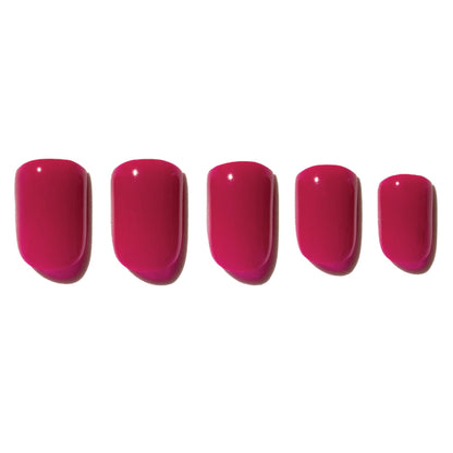 Five pink press on nails on a white background