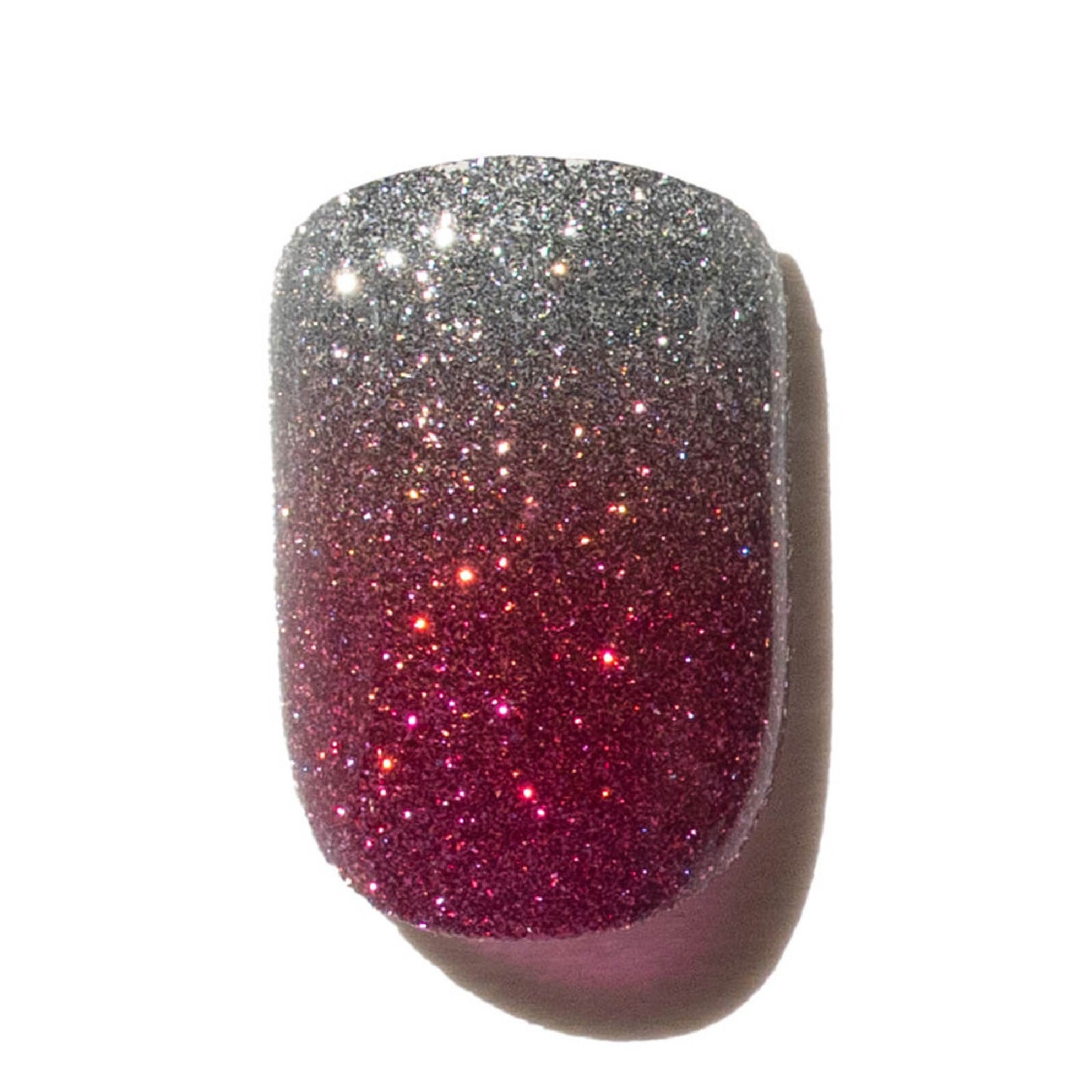 Press on nails with glittery silver and pink gradient on a white background