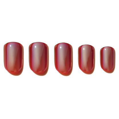 Set of five red press on nails on a white background