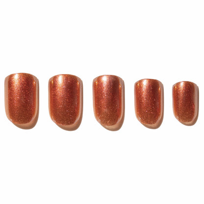 Set of five rose gold press on nails on a white background