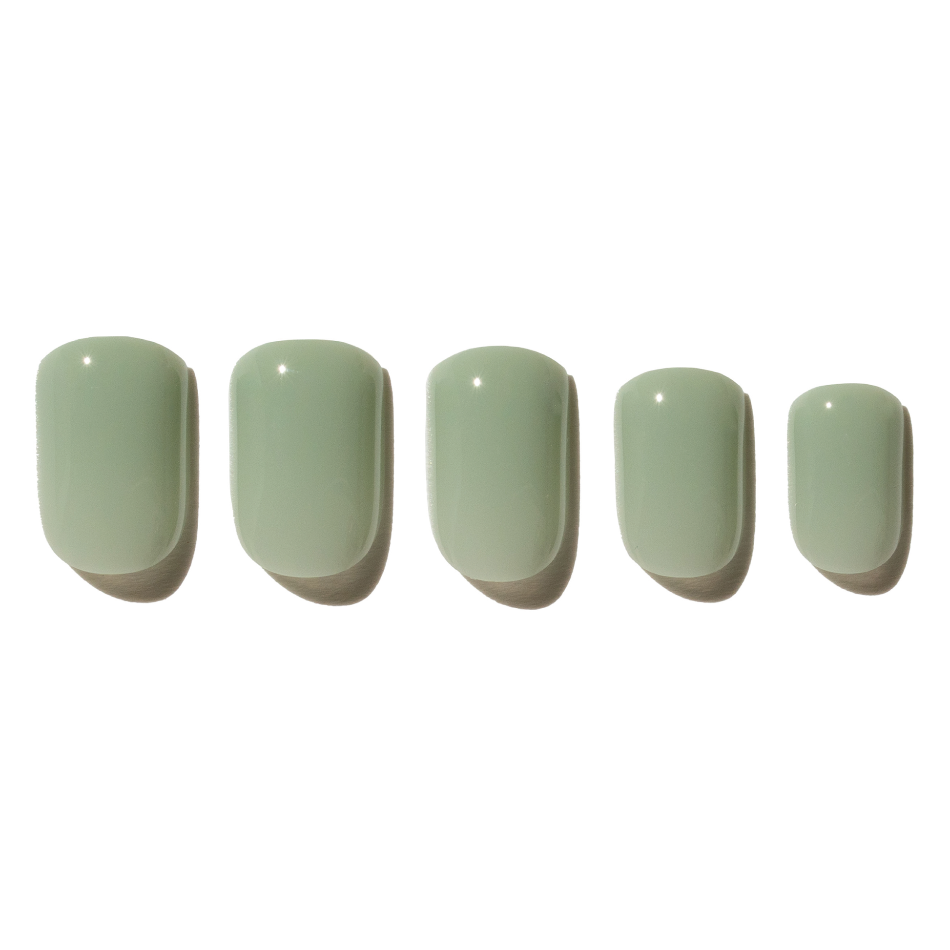 Five light green press on nails on a white background