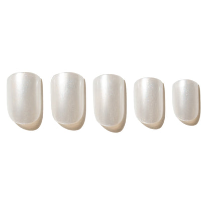 Five white press on nails on a white background